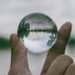 Transparency - Close-Up Photography of Person Holding Crystal Ball