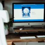 Dropbox - silver imac on brown wooden table