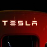 Tesla - Close-up of Illuminated Text Against Black Background