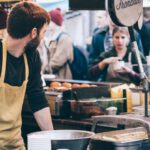 Customers - Man Standing in Front of Bowl and Looking Towards Left