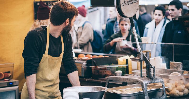 Customers - Man Standing in Front of Bowl and Looking Towards Left