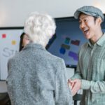 Venture Capitalists - A Man and a Woman Shaking Hands