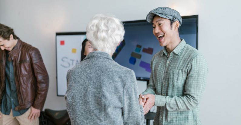 Venture Capitalists - A Man and a Woman Shaking Hands