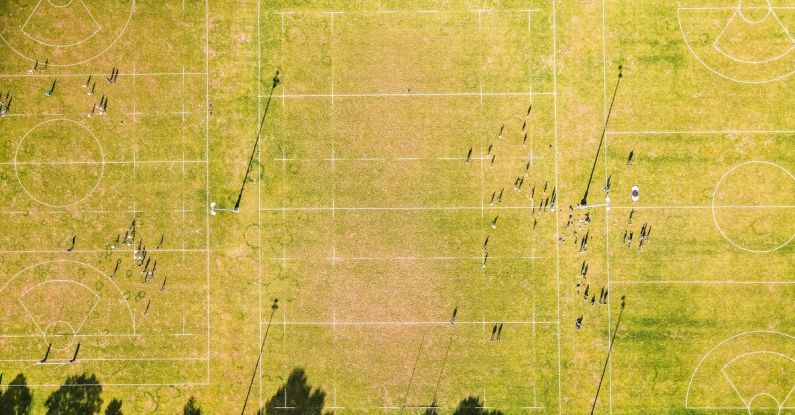 Competitive Landscape - Green rugby pitches on sunny day