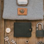 MVP - Gray Shirt and Leather Wallet on Wooden Surface