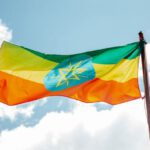 Equity - National colorful flag of Ethiopia under cloudy sky