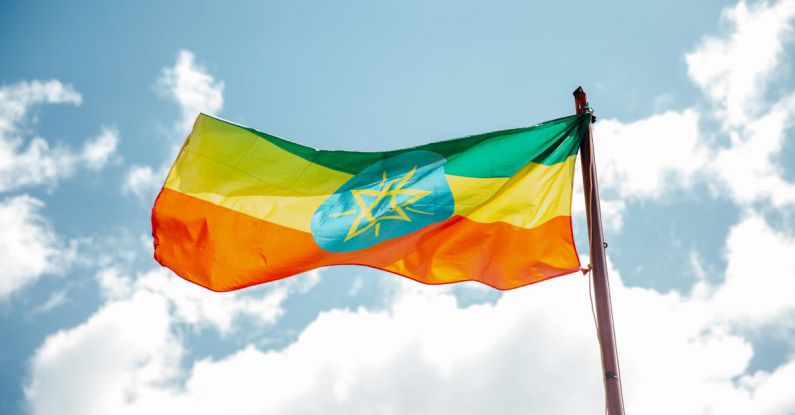 Equity - National colorful flag of Ethiopia under cloudy sky
