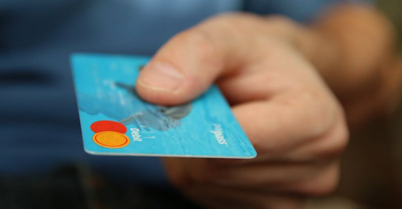 Debt Financing - Person Holding Debit Card