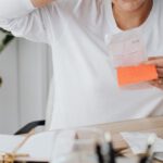 Operational Costs - Woman at Desk Looking at Receipt and Scratching Her Head