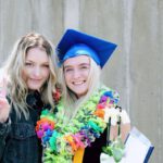 Milestones - Woman Wearing Blue Mortarboard Cap Standing Near Woman Wearing Blue Jacket