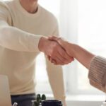 Partnership Dynamics - Man and Woman Near Table