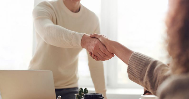 Partnership Dynamics - Man and Woman Near Table