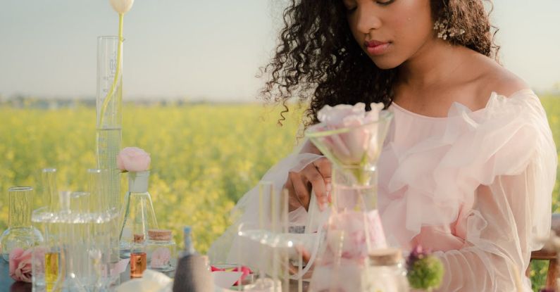 A/B Testing - Young Woman in Airy Summer Dress Creating Perfumes in Flower Field Laboratory