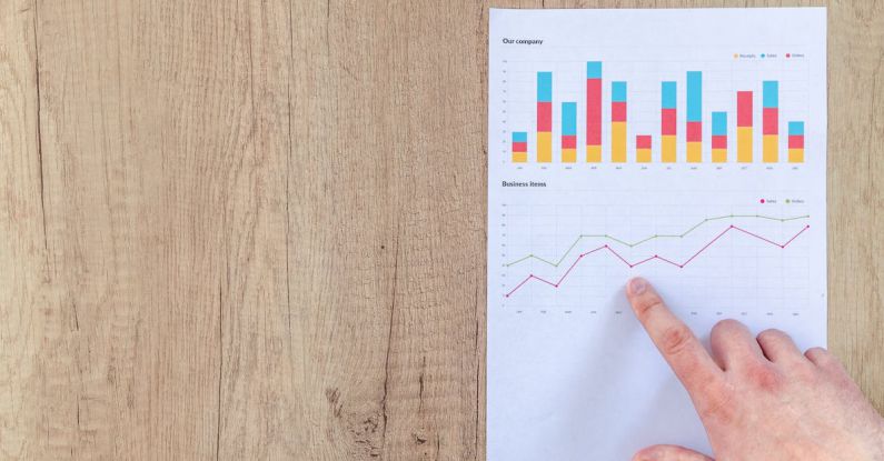 Reporting - Person Pointing Paper Line Graph