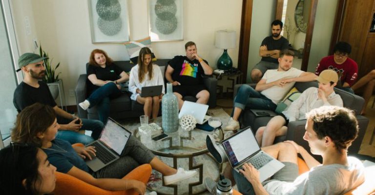 Communicating - Group of People Sitting on Sofa While Discussing