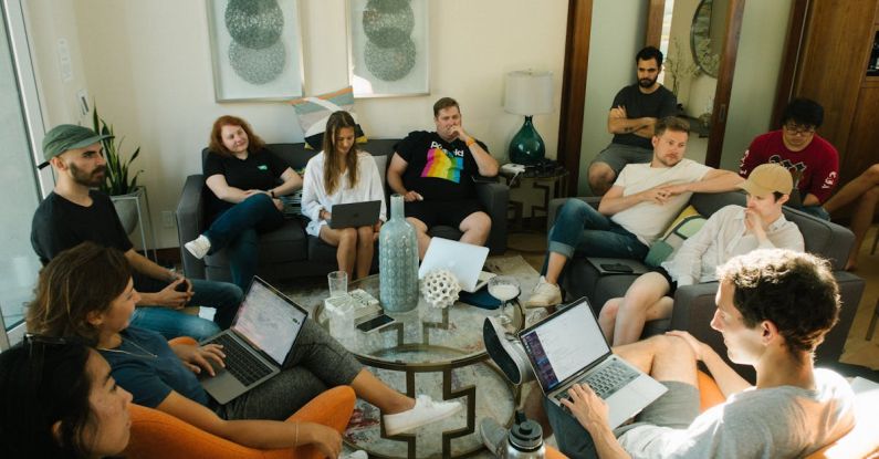 Communicating - Group of People Sitting on Sofa While Discussing