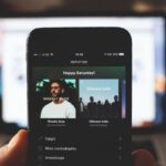 Spotify - Person Using Smartphone