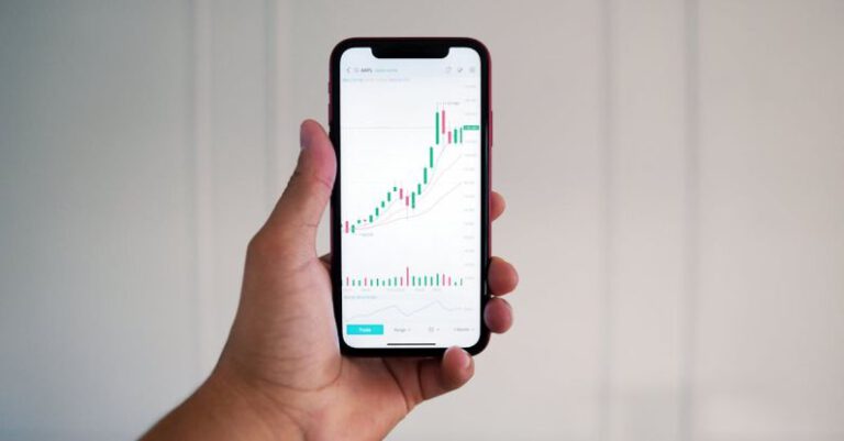 Equity Financing - Person Holding a Phone with Data on the Screen