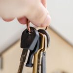 Legal Obligations - Person with keys for real estate