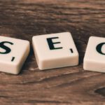 SEO - Three White-and-black Scrabble Tiles on Brown Wooden Surface