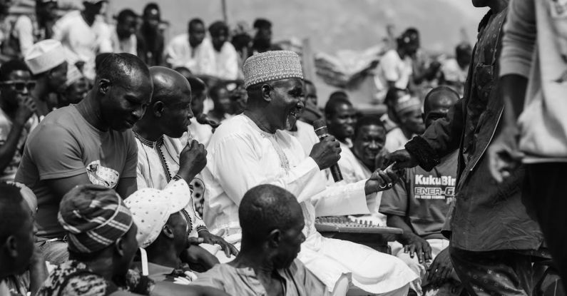 Speaking Techniques - A black and white photo of a man talking to people